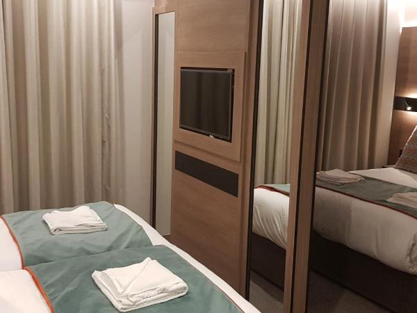 Merit Kensington Hotel : photo 2 de la chambre chambre quadruple supérieure