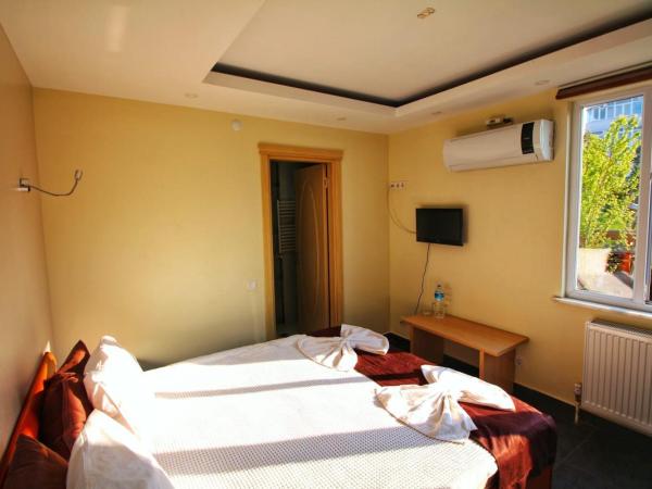 KILIÇ MOTEL : photo 4 de la chambre chambre double - vue sur jardin