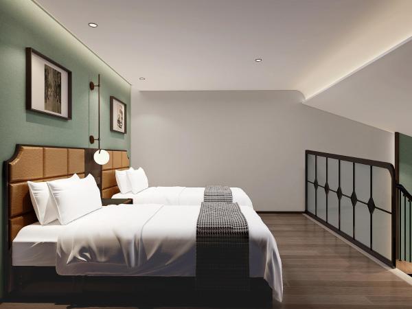 Happy Dragon City Culture Hotel-Tianjin Draum Tower & Dayuecheng shopping mall : photo 10 de la chambre chambre lits jumeaux deluxe