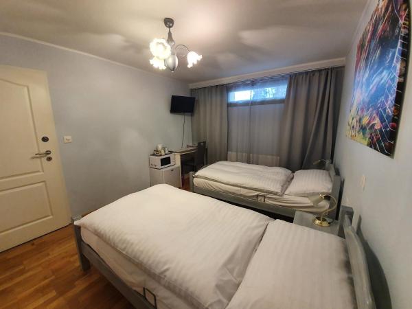 Le Merle Châtelain : photo 2 de la chambre chambre lits jumeaux