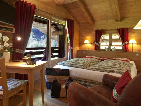 Chalet-Hôtel Les Fermes de Pierre & Anna : photo 1 de la chambre chambre quadruple en duplex