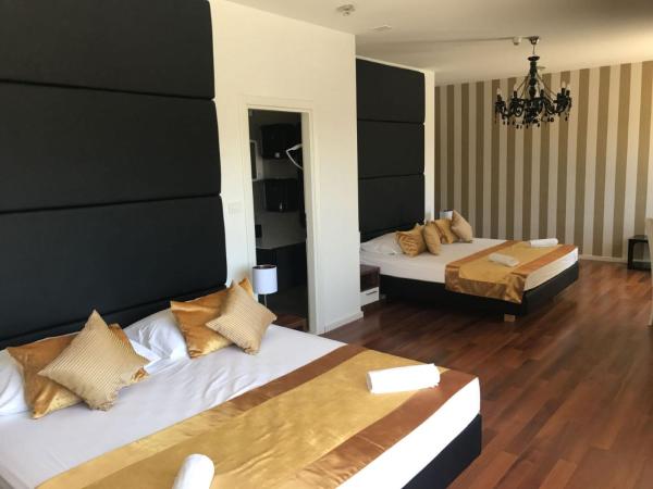 Perla Resort : photo 4 de la chambre chambre quadruple de luxe avec balcon et vue sur la mer