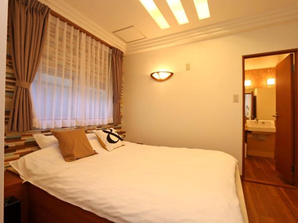 Hotel 3 O'Clock Tennoji : photo 1 de la chambre chambre quadruple avec salle de bains privative