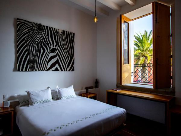 Hotel Los Amantes : photo 1 de la chambre suite lit king-size avec balcon