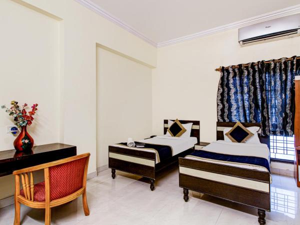 NirmalVilla Cherry : photo 3 de la chambre chambre double deluxe (2 adultes + 1 enfant)