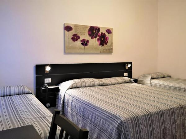 Hotel Rossi : photo 1 de la chambre chambre quadruple