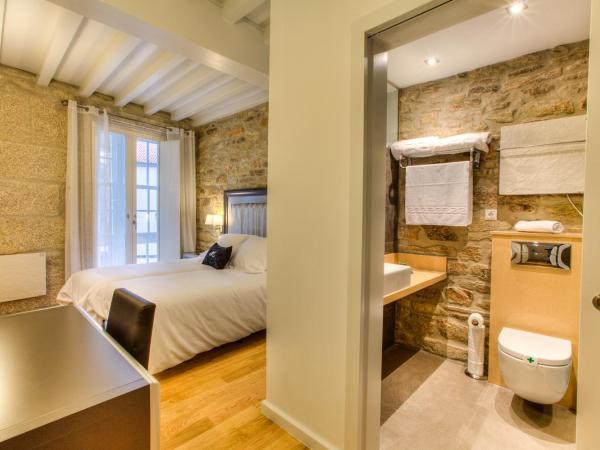 Hotel Montenegro Compostela : photo 1 de la chambre chambre lits jumeaux