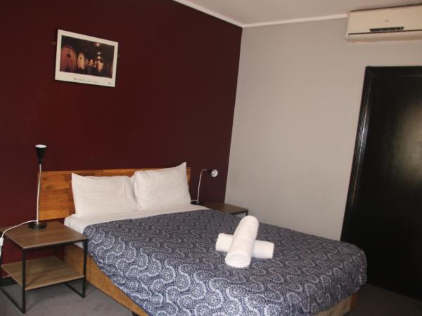 City East Motel : photo 2 de la chambre chambre lit queen-size