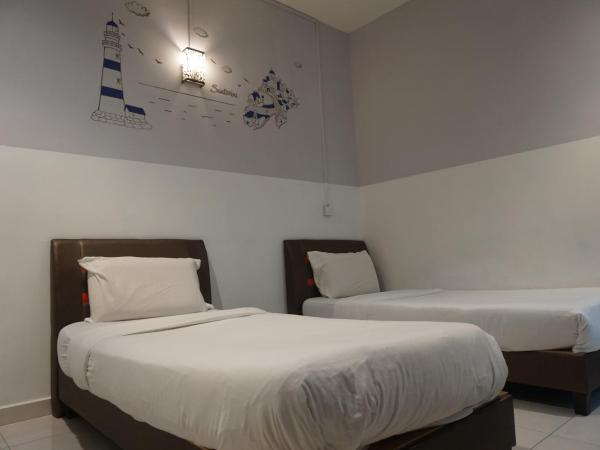 S & S Guest House Kuantan : photo 7 de la chambre chambre lits jumeaux standard