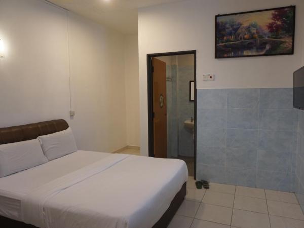 S & S Guest House Kuantan : photo 5 de la chambre chambre standard lit queen-size