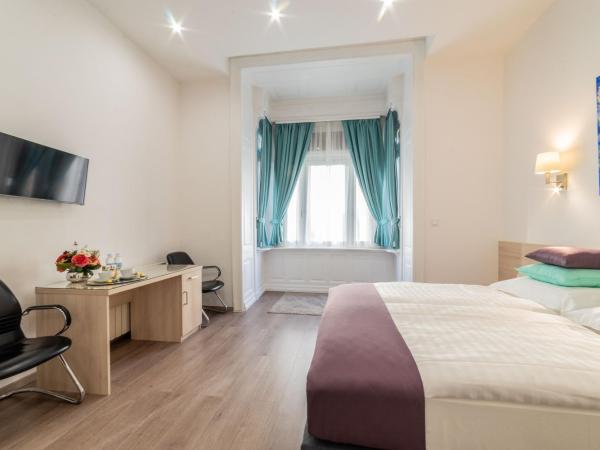 Global Suites Budapest : photo 2 de la chambre chambre double ou lits jumeaux deluxe - vue sur ville