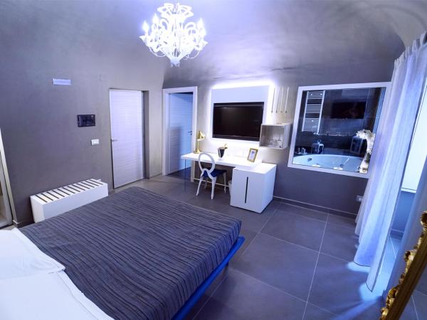 Etna Suite Group : photo 1 de la chambre suite avec baignoire spa