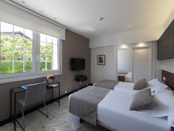 Hotel Avenida : photo 1 de la chambre chambre lits jumeaux