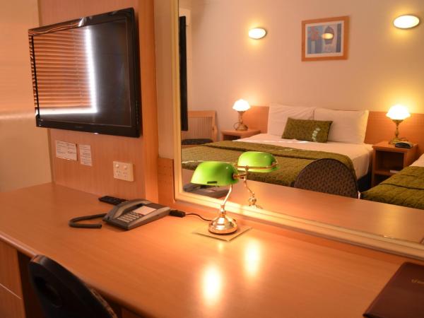 Airport Motel Brisbane : photo 2 de la chambre chambre lit queen-size deluxe