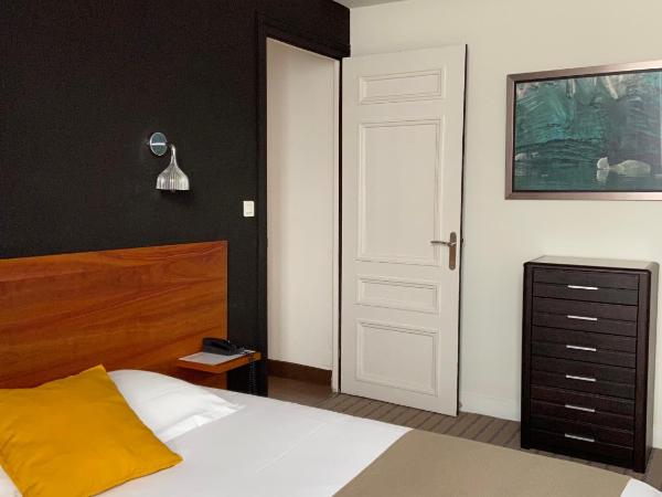 Hôtel De France - Restaurant L'insolite : photo 3 de la chambre chambre double/lits jumeaux côté cour