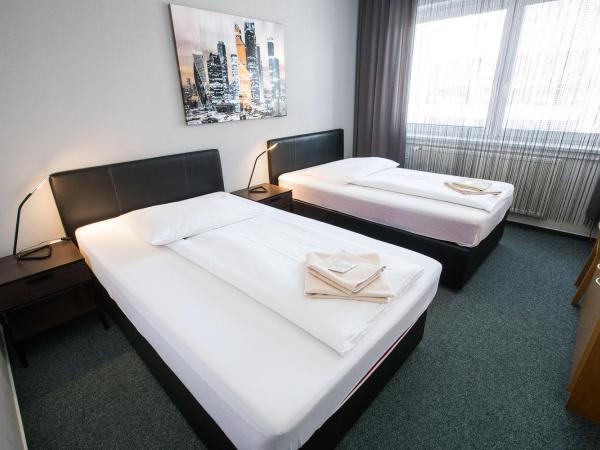 A-Sport Hotel : photo 1 de la chambre chambre lits jumeaux