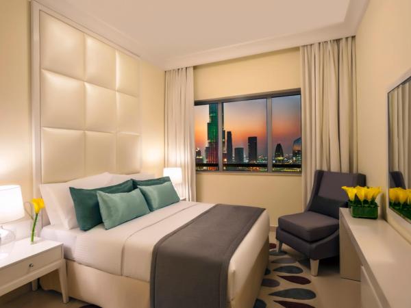 DAMAC Maison Mall Street : photo 1 de la chambre chambre deluxe - vue sur ville