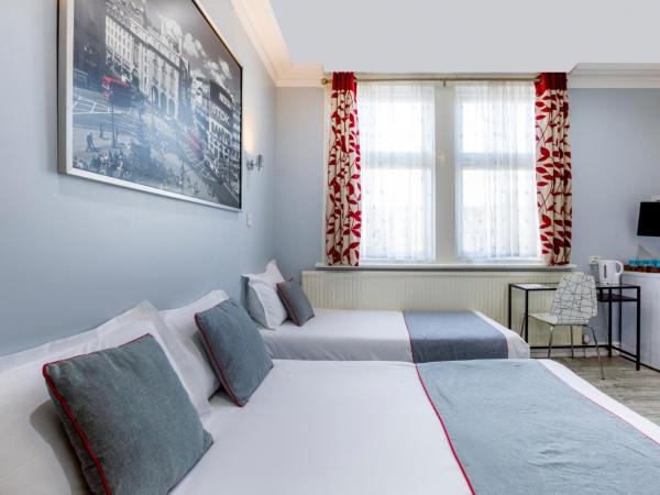 OYO Sino Hotel : photo 1 de la chambre chambre quadruple standard