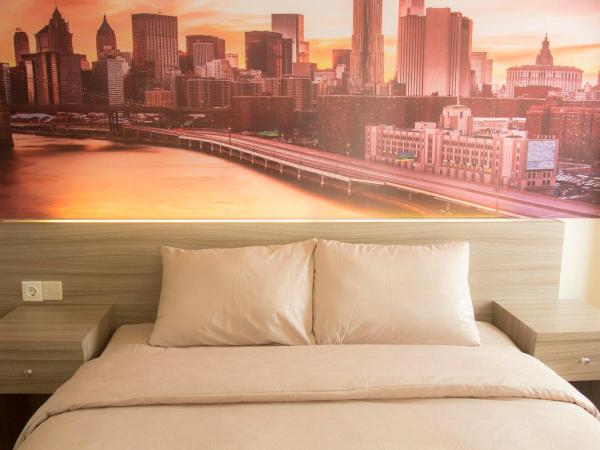 DE GREEN INN Kebon Jeruk : photo 7 de la chambre chambre double supérieure