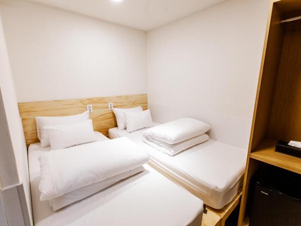 Step Inn Myeongdong 1 : photo 2 de la chambre chambre lits jumeaux Économique sans fenêtre