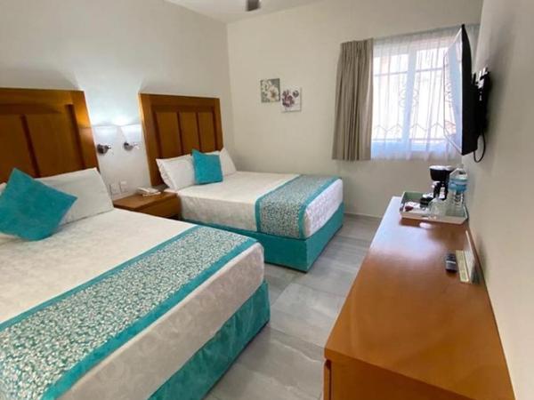 Hotel Posada Quinta Las Flores : photo 4 de la chambre chambre lits jumeaux deluxe