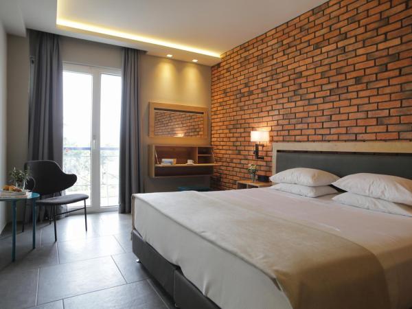 Palmyra Beach Hotel : photo 2 de la chambre chambre double ou lits jumeaux supérieure avec vue latérale sur la mer