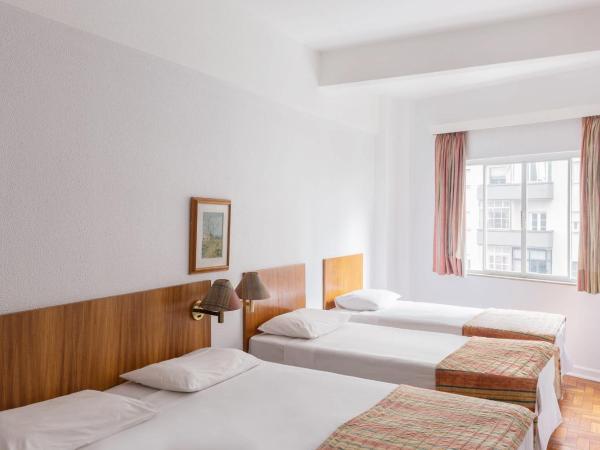 Hotel Rojas All Suite : photo 4 de la chambre suite exécutive avec 1 lit queen-size et 4 lits simples