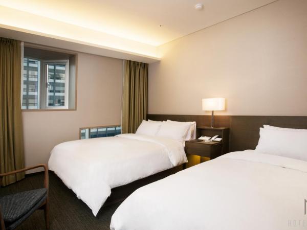 Hotel Manu Seoul : photo 1 de la chambre chambre lits jumeaux familiale
