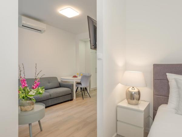 CAPITAL Apartments and Rooms : photo 2 de la chambre studio lit king-size deluxe