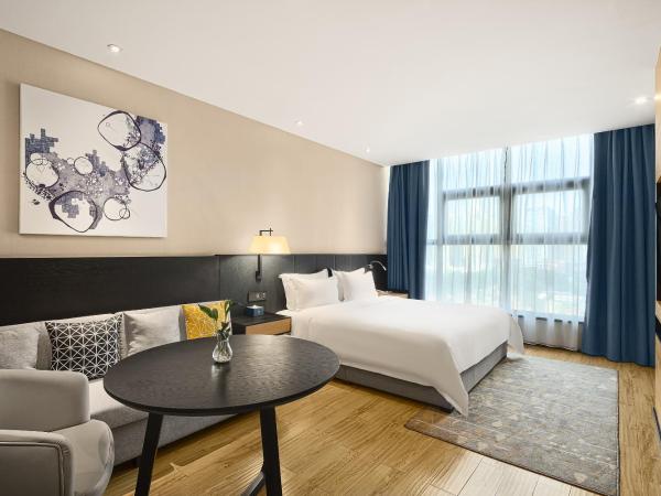 成都V hotel精品酒店 : photo 1 de la chambre chambre lit queen-size deluxe