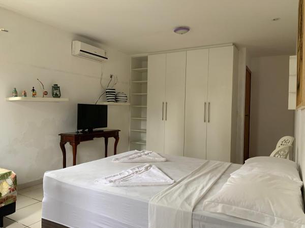 Porto das Palmeiras Hostel : photo 3 de la chambre chambre quadruple Économique avec salle de bains commune