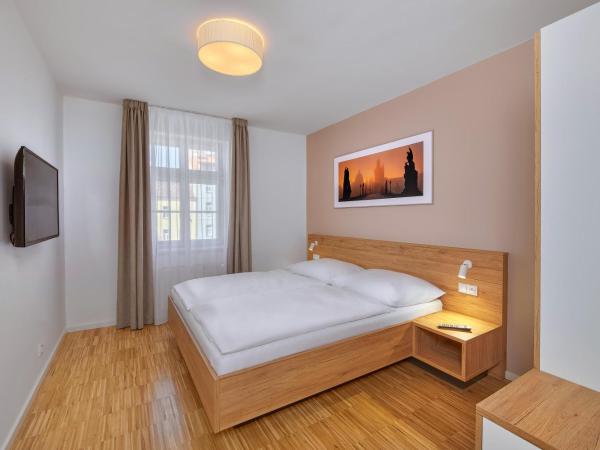 Downtown Suites Kodanska : photo 1 de la chambre hébergement quadruple 2 chambres