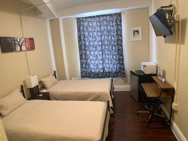 Orange Village Hostel : photo 3 de la chambre chambre lits jumeaux avec douche