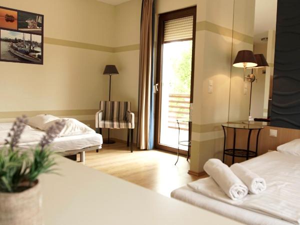 Fürjes Villa Apartmanház : photo 1 de la chambre studio avec canapé-lit