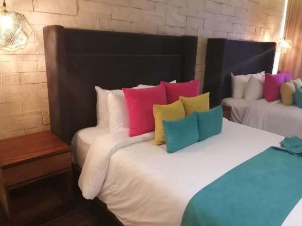 Hotel Beló Isla Mujeres - All Inclusive : photo 2 de la chambre suite junior de luxe avec 2 lits doubles