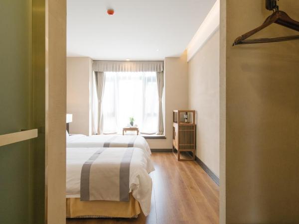 Guan Sam Hotel : photo 4 de la chambre chambre lits jumeaux - vue sur jardin