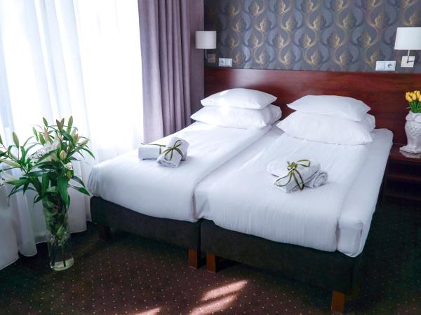 City Center Rooms Piotrkowska 91 : photo 2 de la chambre chambre double ou lits jumeaux
