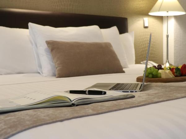 Mesón Ejecutivo Guadalajara Minerva - Av México : photo 4 de la chambre chambre lit king-size supérieure