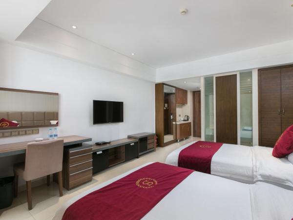 Sanya Sun and Sea Gueshouse : photo 2 de la chambre chambre lits jumeaux - vue latérale sur mer