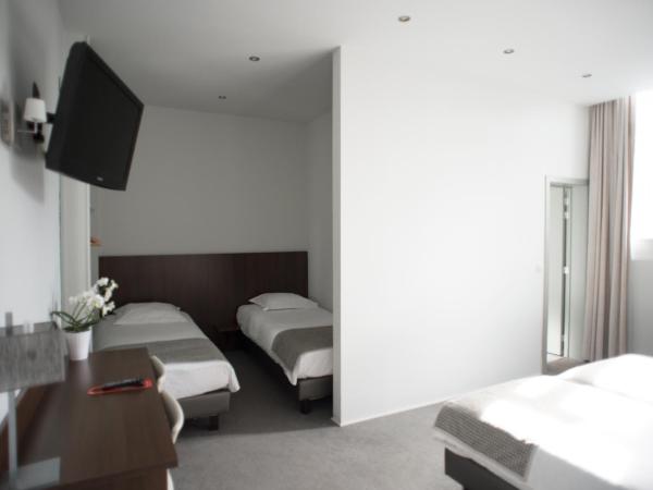 Hotel Du Congres : photo 1 de la chambre chambre quadruple