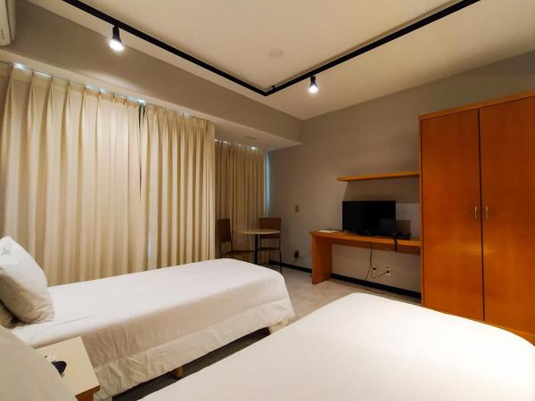 Savassi Village : photo 10 de la chambre chambre double ou lits jumeaux deluxe - vue sur ville