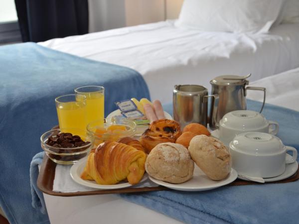 Hotel Girassol : photo 2 de la chambre chambre triple