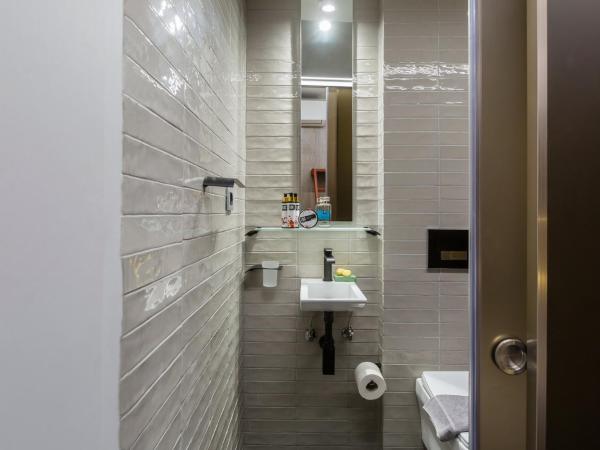 LOC HOSPITALITY Urban Den : photo 9 de la chambre petite chambre lits jumeaux