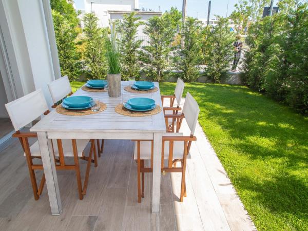 MARINA PONENTE : photo 7 de la chambre appartement - vue sur jardin