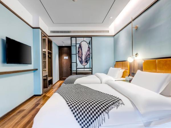 Happy Dragon City Culture Hotel-Tianjin Draum Tower & Dayuecheng shopping mall : photo 7 de la chambre chambre lits jumeaux avec salle de bains privative