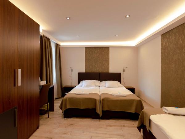 Vén Diófa De Lux Panzió : photo 3 de la chambre chambre triple
