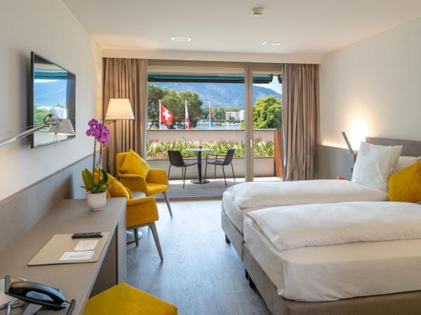 Hotel Lago Maggiore - Welcome! : photo 5 de la chambre chambre double ou lits jumeaux de luxe - vue partielle sur lac
