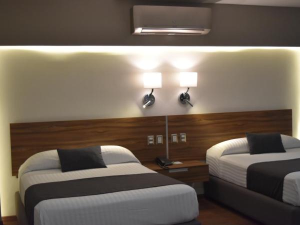 Estanza Hotel & Suites : photo 3 de la chambre chambre lits jumeaux