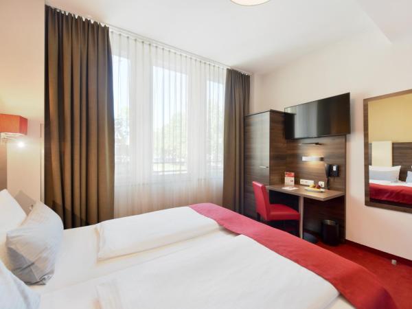 KOOS Hotel&Apartments - City Aparthotel : photo 8 de la chambre chambre double ou lits jumeaux