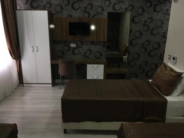 Petrol-İş İstanbul Misafirhanesi : photo 2 de la chambre chambre lits jumeaux avec lit d’appoint - 301